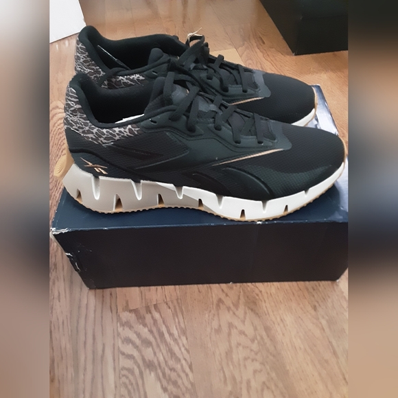 Reebok Shoes - New Reebok Running Shoe Womens 9.5 Black and Animal Print